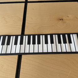 Sharper Image portable, roll-up electronic piano keyboard,