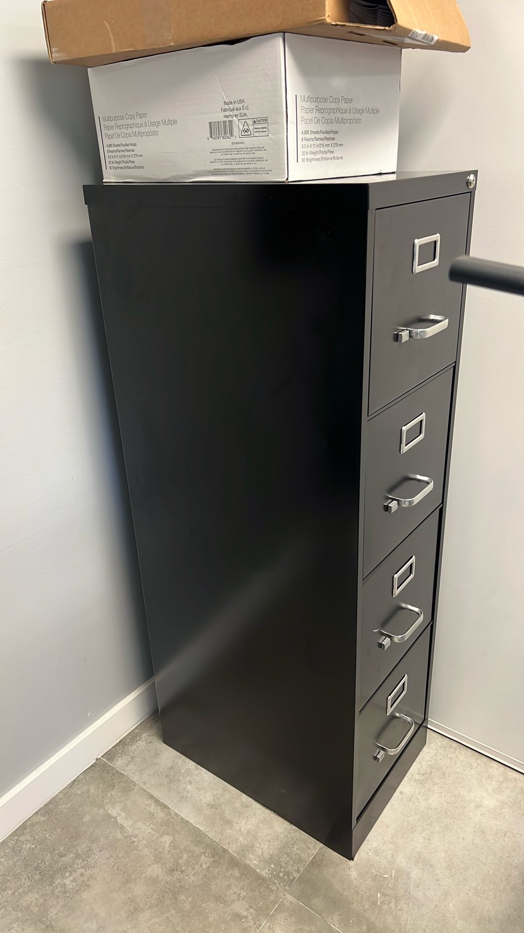 File Cabinet (Approximately 4 Feet Tall with Four Sections: Open and Closed Tabs) 