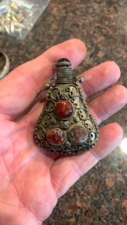 Vintage silver plate perfume bottle missing one stone on the back