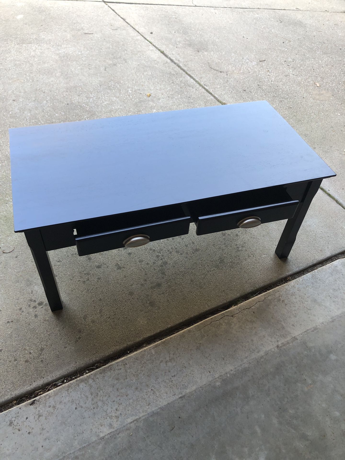 Back coffee table. 38 inches long, 19 inches wide and 17 inches tall. $25, OBO.