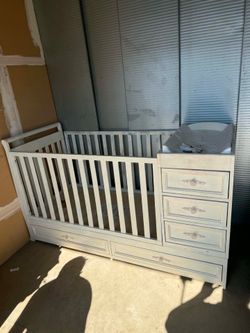 Changing table with crib