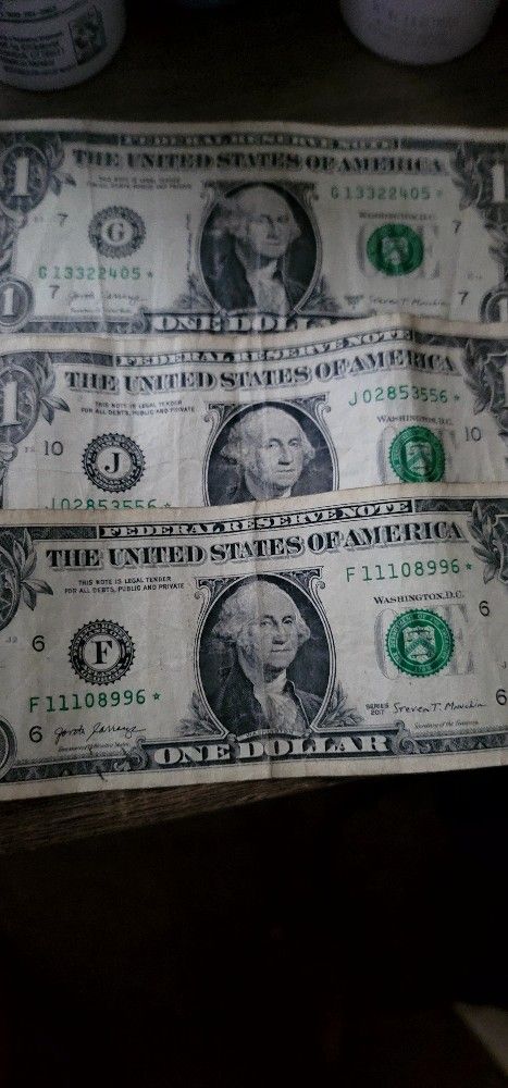 For collectors of one-dollar bills with a star, how much are you offering for these three bills?