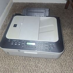 Canon Pixma MX320 all-in-one inkjet printer, which is designed to print, scan, and copy documents.