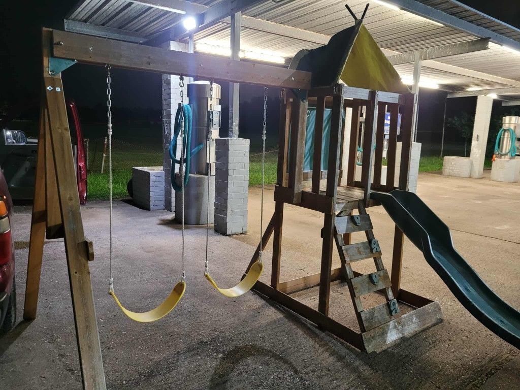 Outdoor Swing Set With A Slide