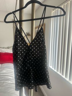 Women’s black polkadotted top