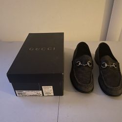 Black and silver Gucci shoes