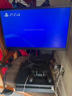 Sony PS4 Slim Console with Controller and monitor
