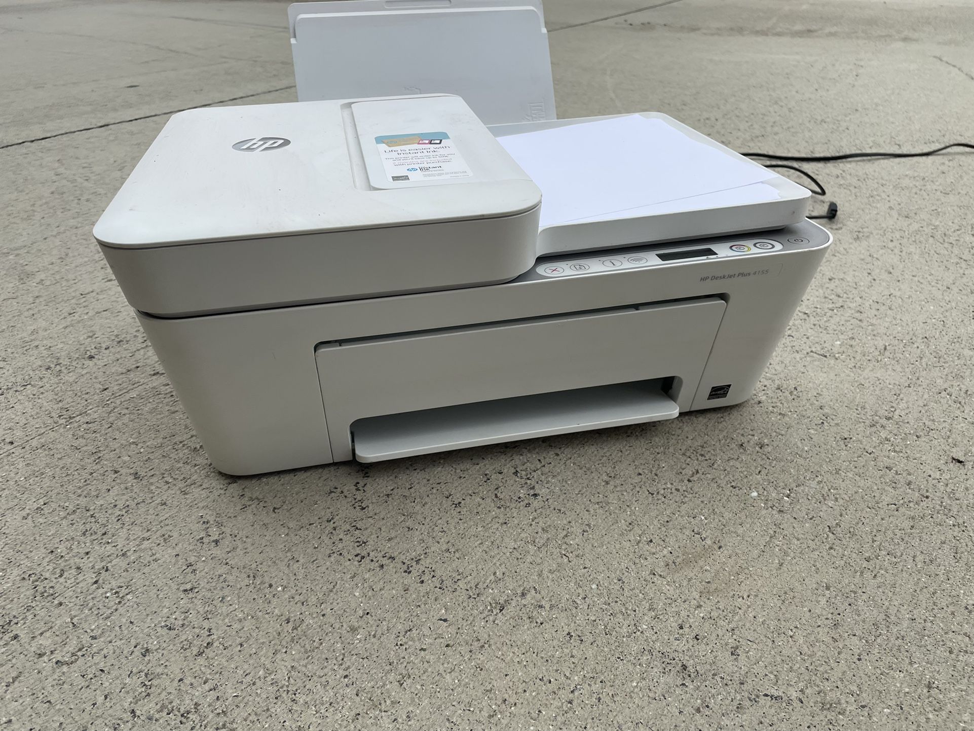 Printer And Stack Of Paper