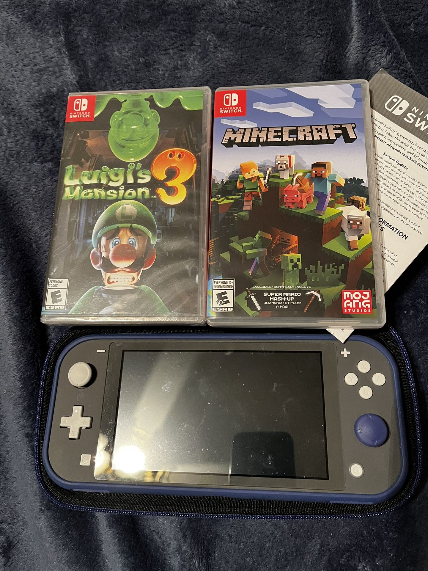 Nintendo Switch Lite With Two Games