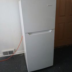 a very nice refrigerator. and deep Freezer And A kitchen Table With two chairs 