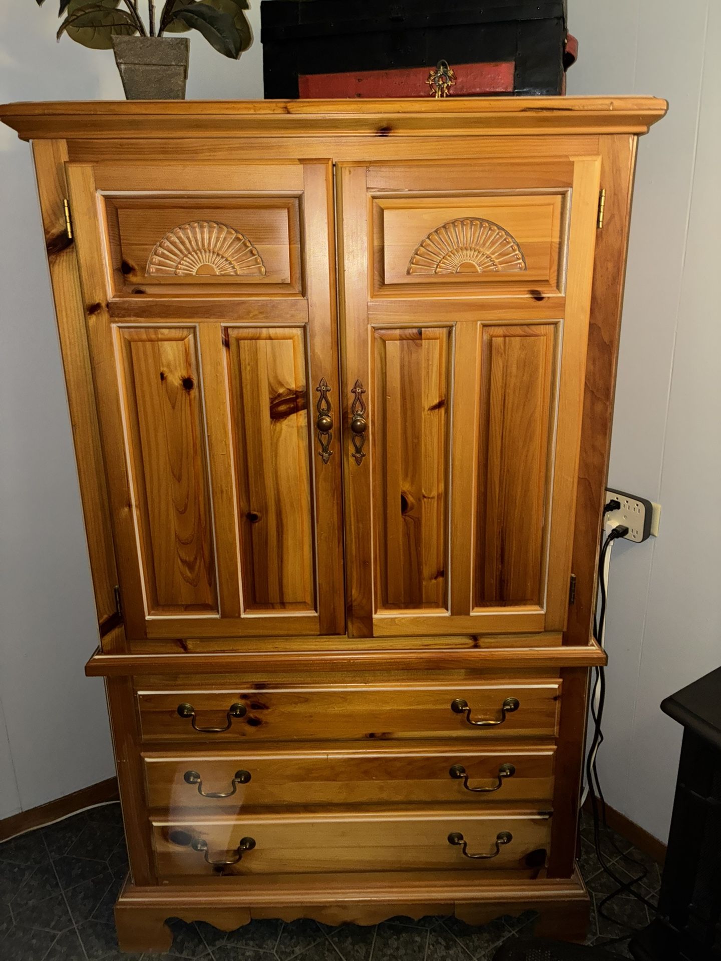 Broyhill Fontana knotty pineu armoire.