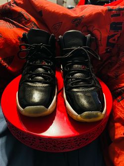 Air Jordan 11 Black High-Top Sneakers