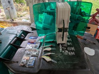 Double sided plano tackle box w/ weights, lures, hooks.