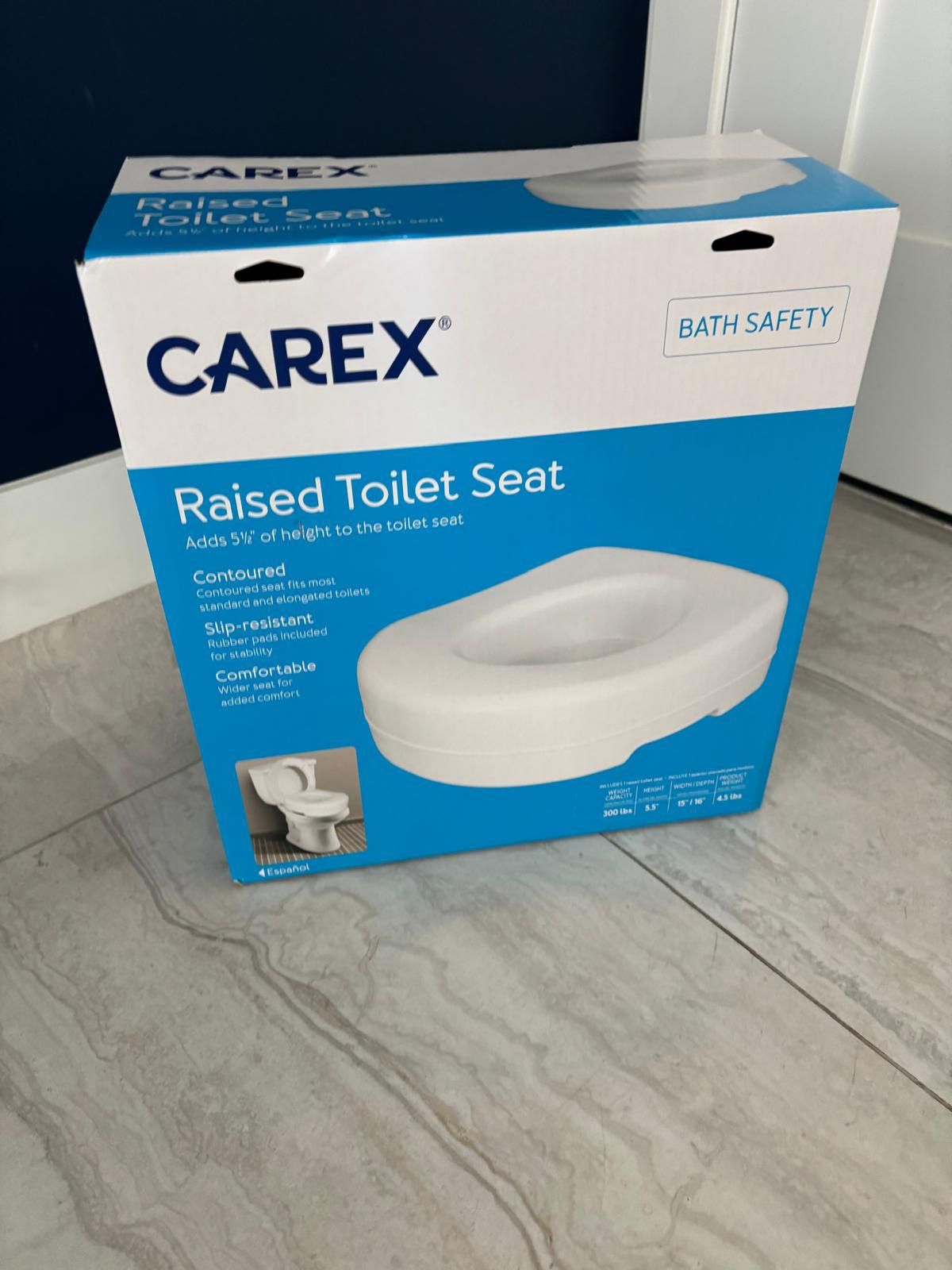 CAREX raised toilet seat. Brand new in the box. 300 lb capacity. 5.5 inches high