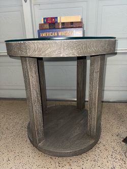 Crossings Serengeti Round End Table features glass shelf,