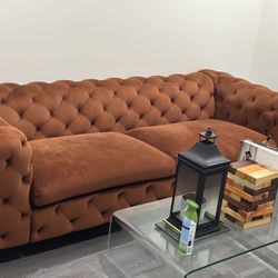 93” long rusty brown suede tuffed sofa