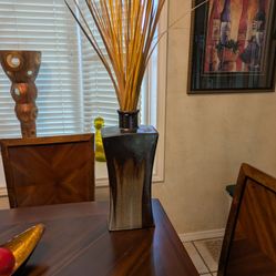 Ceramic Vase With Colorful Reeds Coming From The Top