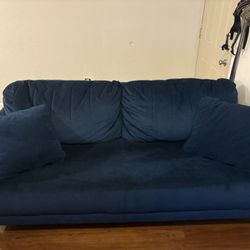 Blue Suede Couch With Pillows