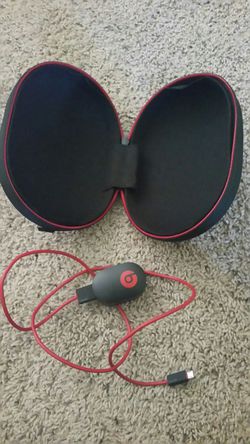 Beats headphone case and charger.