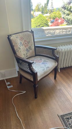 2matching wicker and holstered chairs