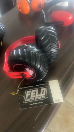 MONSTER JAMS EAR MUFFS  RED NEW YELLO W HAS A LITTLE DEFECT  5$  TGE RED NEW WITH TAGS 10$