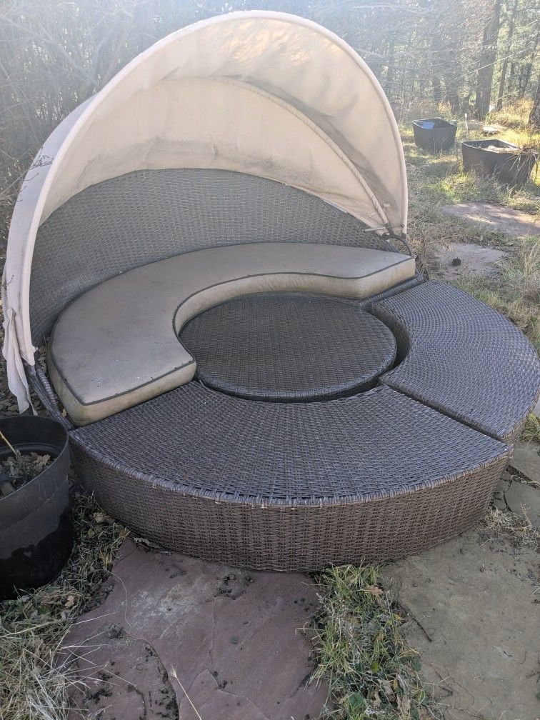 Four-Piece Rattan Daybed Set Missing A Couple Of Cushions