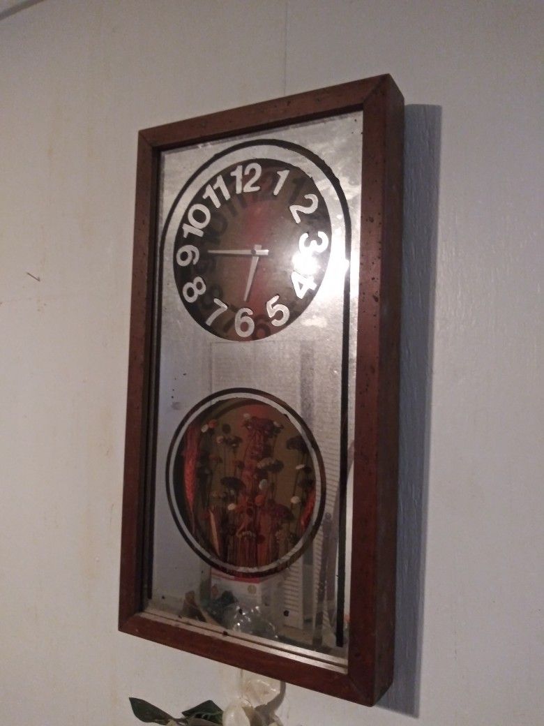 Framed Clock Mirror Showcasing Beautiful Dried Flowers