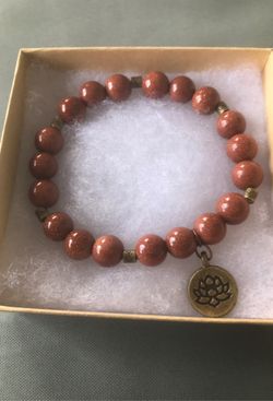 Brown sand stone stretch bracelet with lotus charm