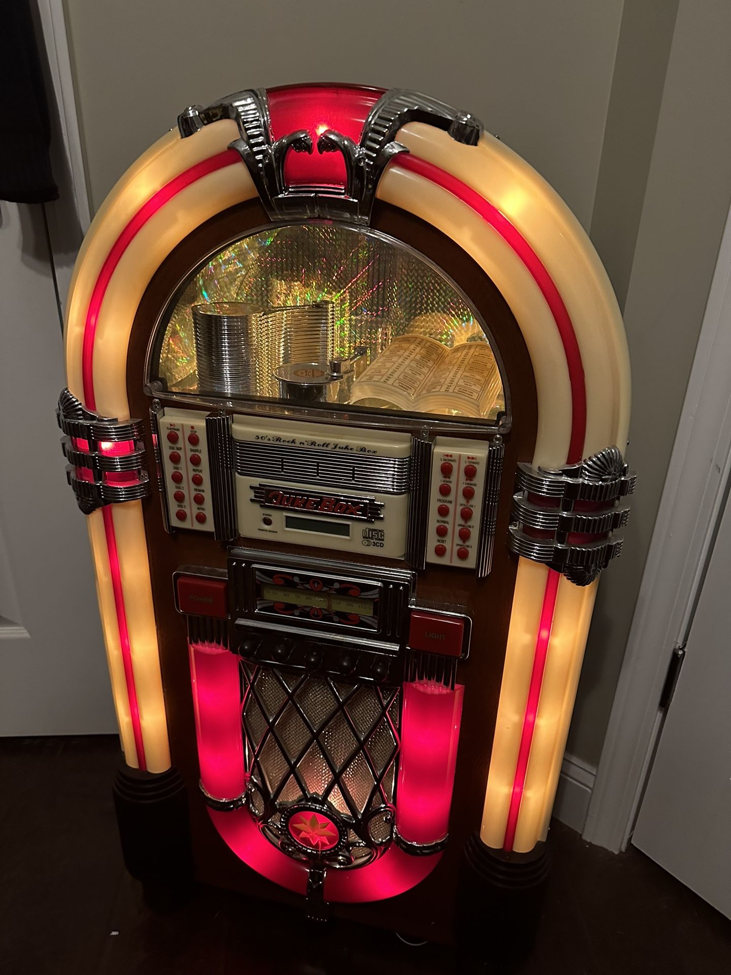Very Nice Large Size JukeBox play with Radio and Bluetooth (cassette). The juke is almost 4 feet tall. It works fine witb radio and Bluetooth with cas