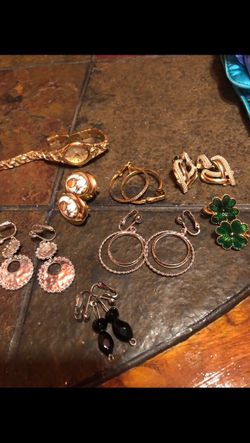 Assorted earrings and watch