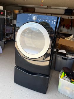 Black Maytag Dryer with pedestal shelf