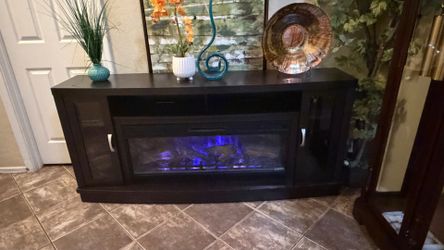 Beautiful fireplace /tv stand with 5 colors of flames 70” inches long