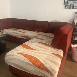 Red couch with cover