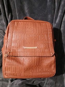 Steve Madden Brown Logo tassel Backpack purse. Like New