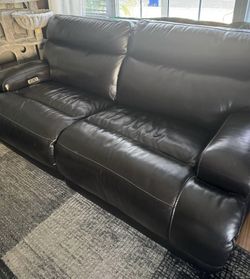 Leather power reclining sofa