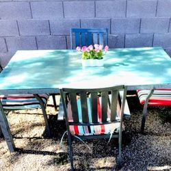 Patio Furniture Glass Table and Four Metal Chairs With Cushions