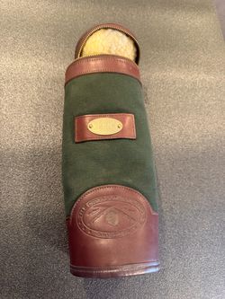 Orvis Battenkill Wine Bottle Holder: hunter green canvas and brown leather trim.