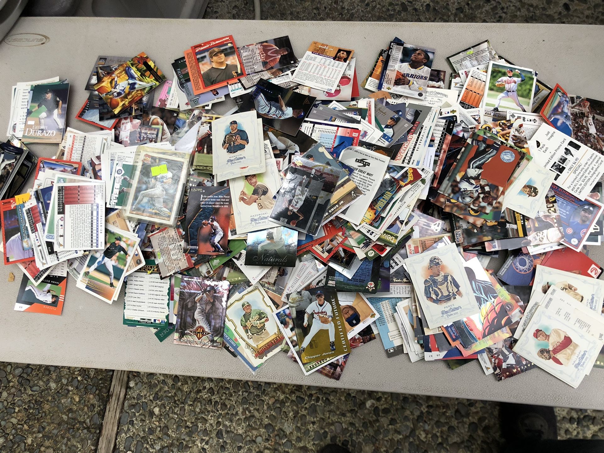 1000 baseball, football, and basketball cards