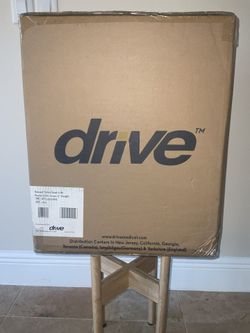 New raised toilet seat with removable arms. Manufacturer brand Drive.  Model  RTL 12027RA.  Home care, convalescent.