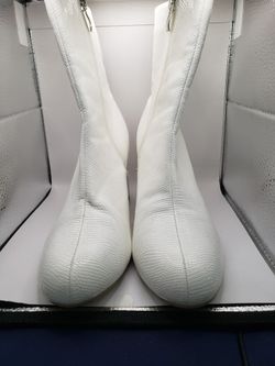 Size 6.5--7, a white faux-snakeskin ankle boot