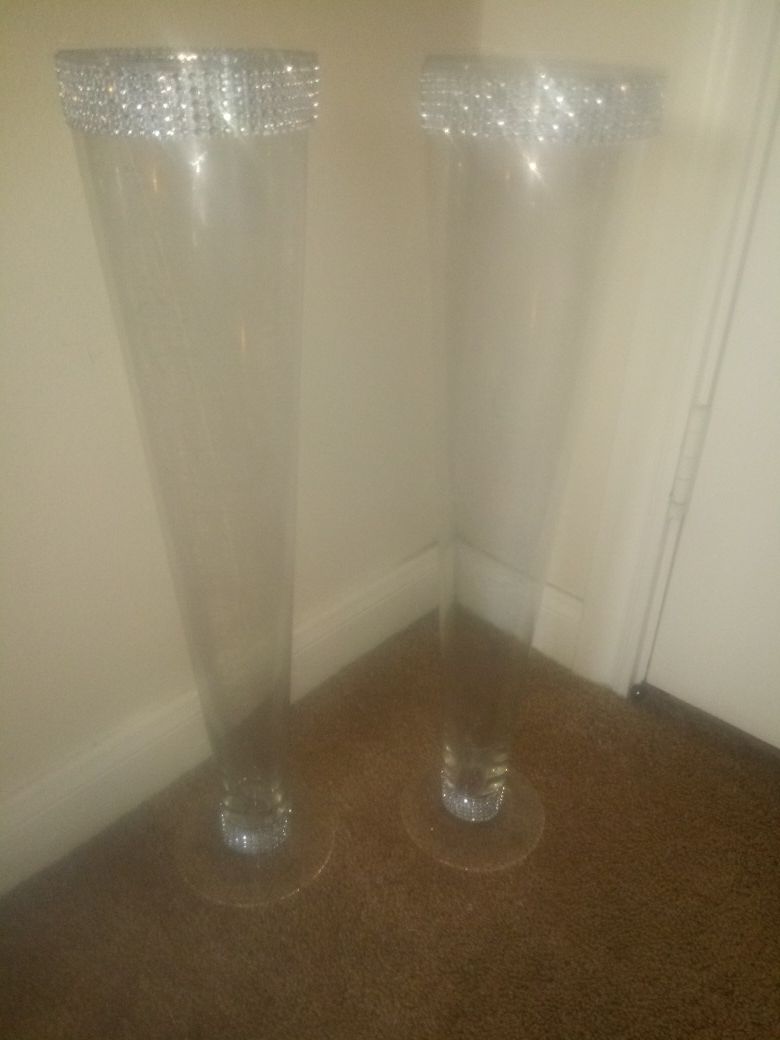 2 tall glass vases