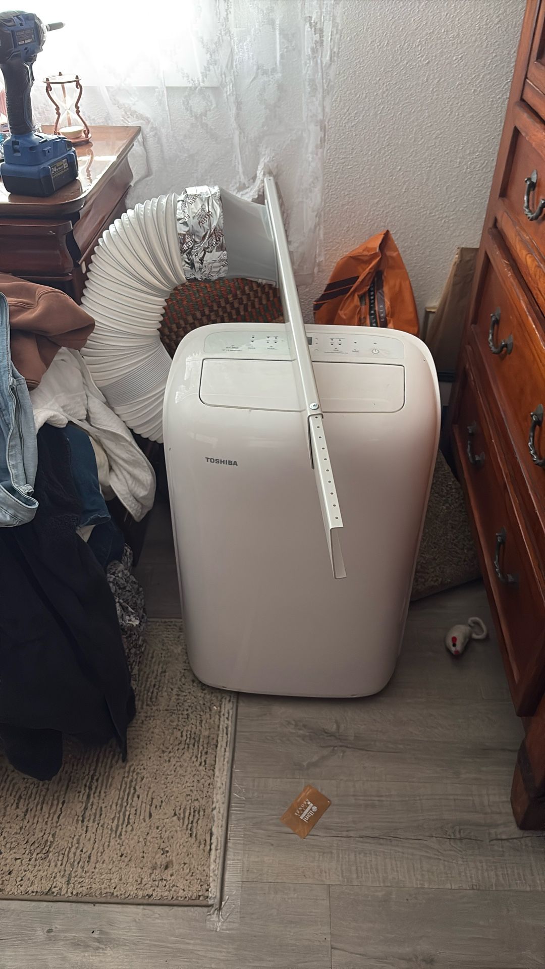 Toshiba portable air conditioner with hose that goes through the window as well as the window attachment. Like no, we used it once while our e our air