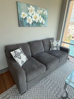 Three-Seat Gray Couch with Decorative Throw Pillows