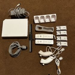 Wii with controllers, battery packs, and controller charger