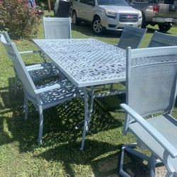 Cast iron table with six chairs