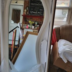 Brand new full length curved mirror.