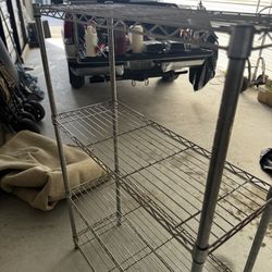 Four tier heavy duty, steel freestanding shelf unit