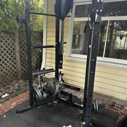 All For $200 Pickup Today Squat Rack, dumbbells, Barbell, Curl Bar, Two Benches, And Gym Mat Underneath. 