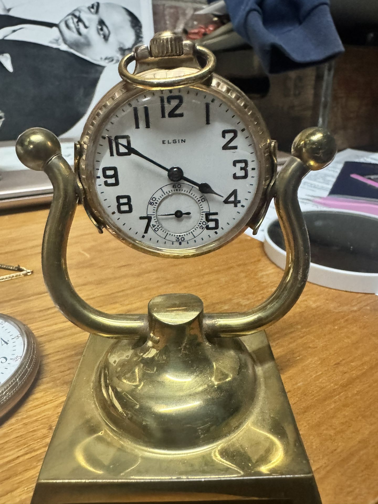 Elgin pocket watch on a brass stand. Elgin Vintage/Antique