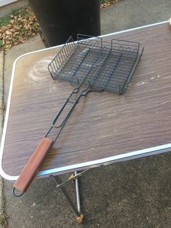 Fish caged for grill